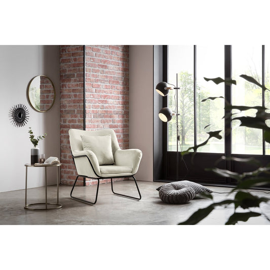 Lounge chair upholstered in beige velvet